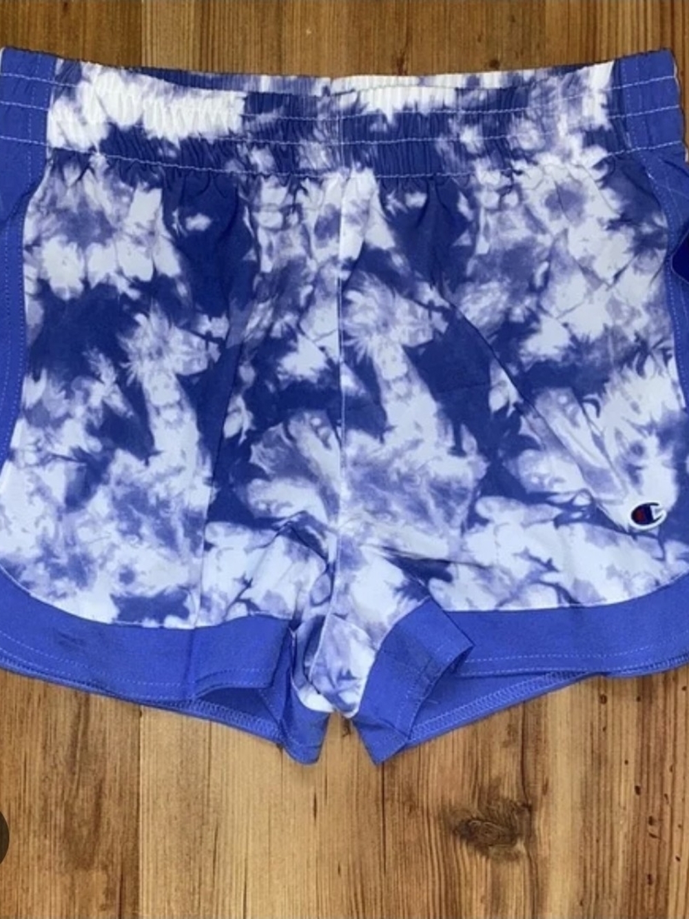 Champion girls' lightweight athletic shorts in a blue and white tie-dye pattern.